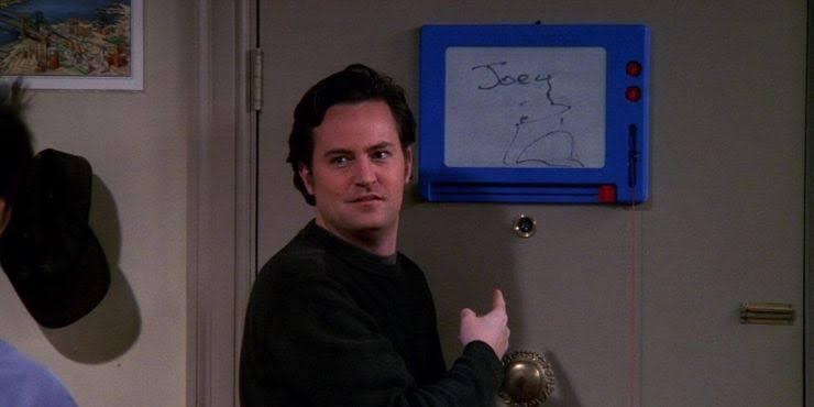 Chandler leaves an illegible message on the Magna Doodle in Friends