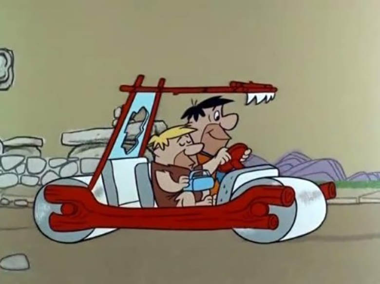 The Flintstones – Fred and Barney cruising in Fred’s foot-powered car