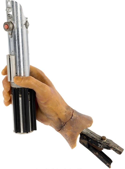 Heritage entertainment auction lightsaber and hand rig from The Empire Strikes Back